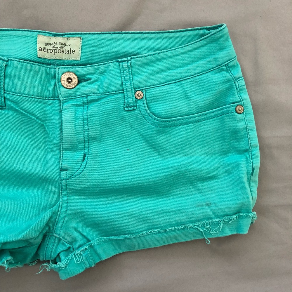 Teal cuffed cut off shorts